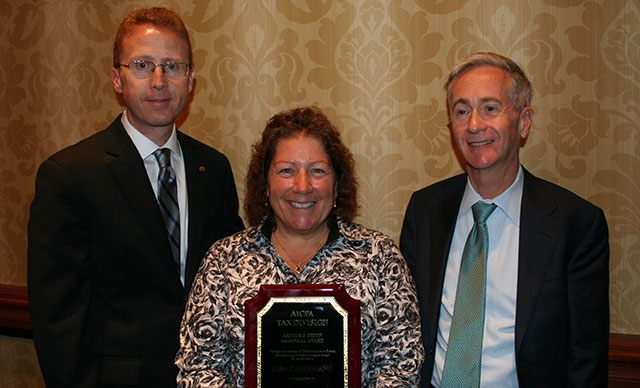 tax-award Troy K. Lewis (left), Lisa C. Germano, and Eddie Adkins